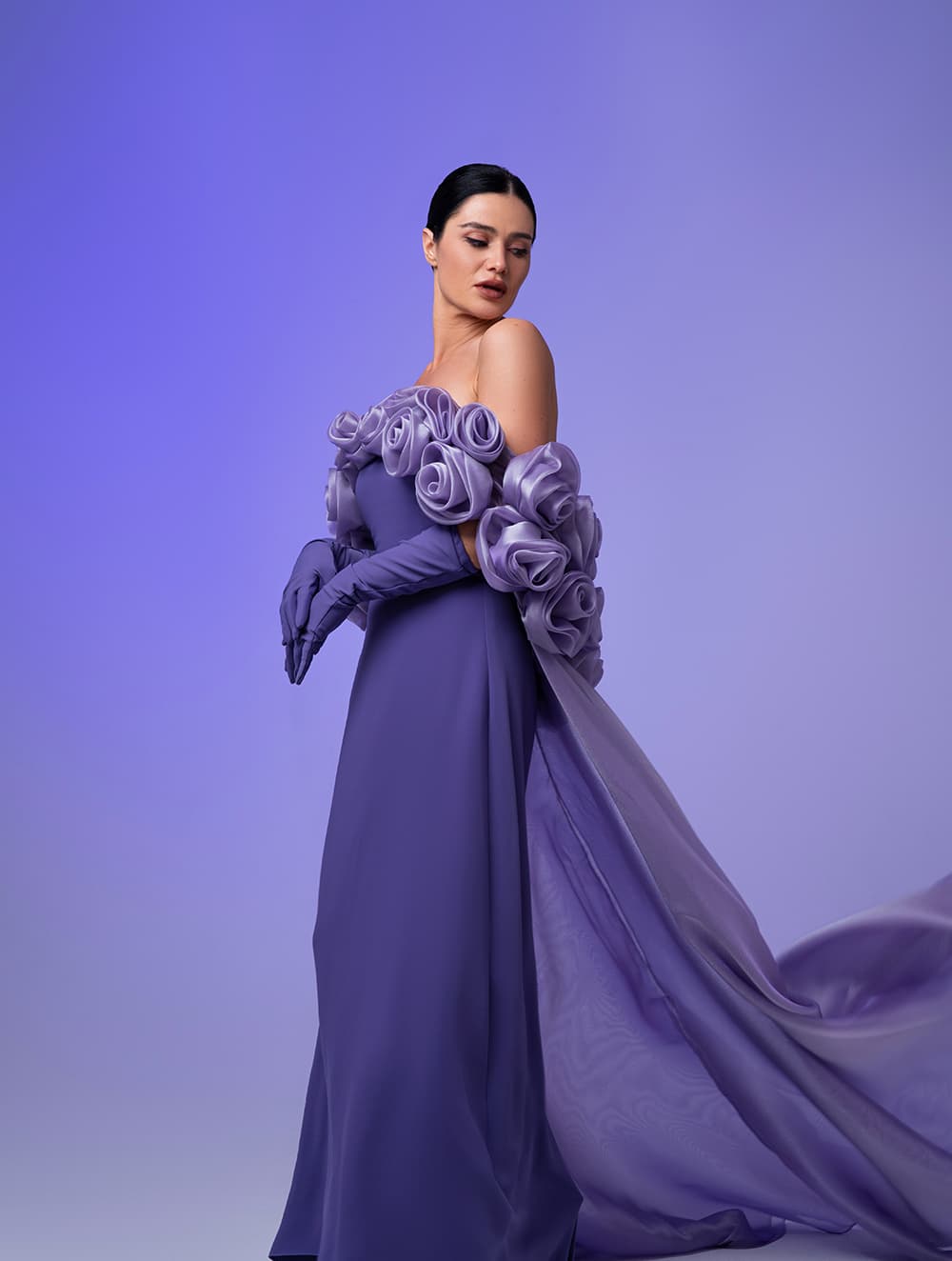 Lavender rose-shoulder gown with flowing organza train